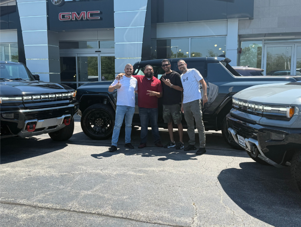Three new Hummer EV owners with their salesman, Tony Hendershot

