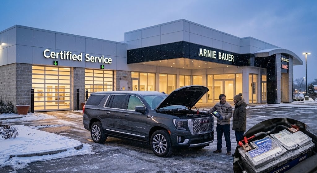 Arnie Bauer Buick GMC Certified Service technician performing a winter battery test on a vehicle outside the Matteson dealership.